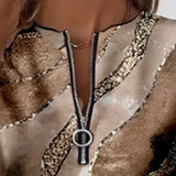 Arlena – moderna bluza s apstraktnim uzorkom i patentnim zatvaračem